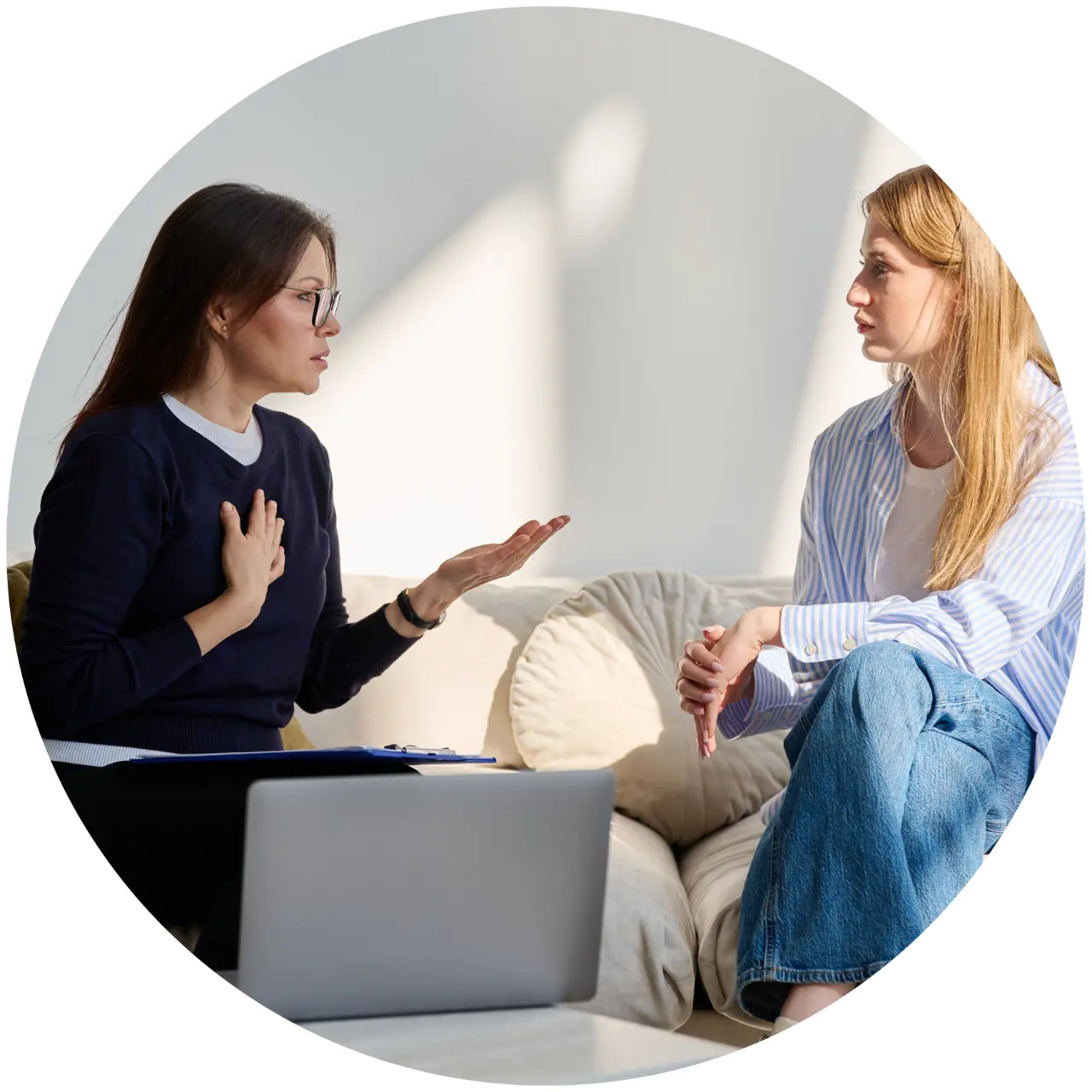 Therapist talking with client on couch